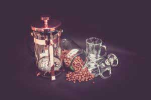 glass cups with some coffee beans & glass jar
