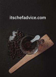 coffee beans near a cup of coffee
