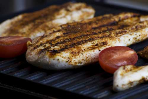 chicken breasts on a grill