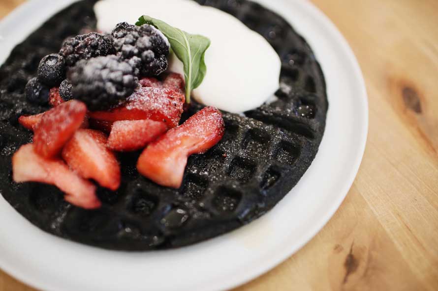Chocolate waffle with some berries on it