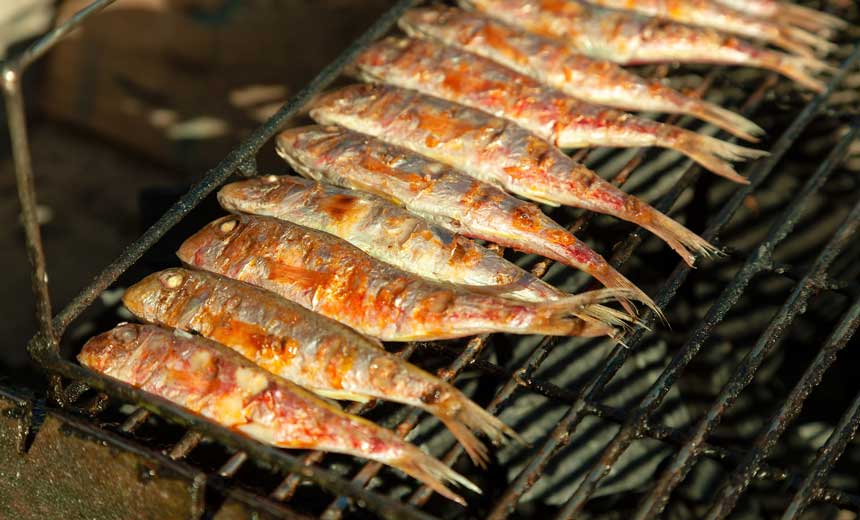 grilling fish on a greasy grill 