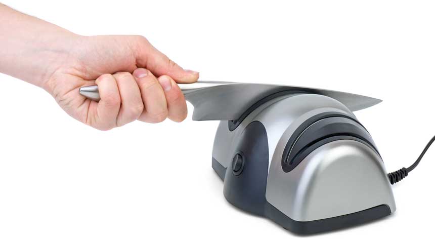 a man using grey & black electric knife sharpener to sharpen his knife