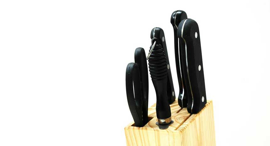 black handled knife set in a wooden box