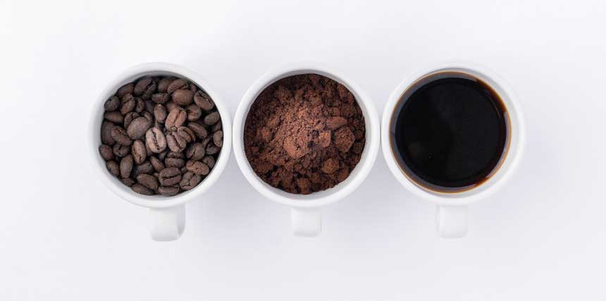 3 cups of coffee, 1 is full of coffee beans, 2nd is full of coffee powder and 3rd is full of black liquid coffee