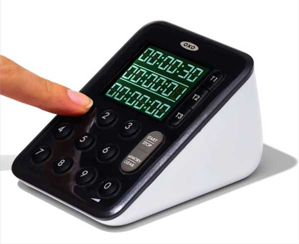 Someone setting up time on Oxo digital timer