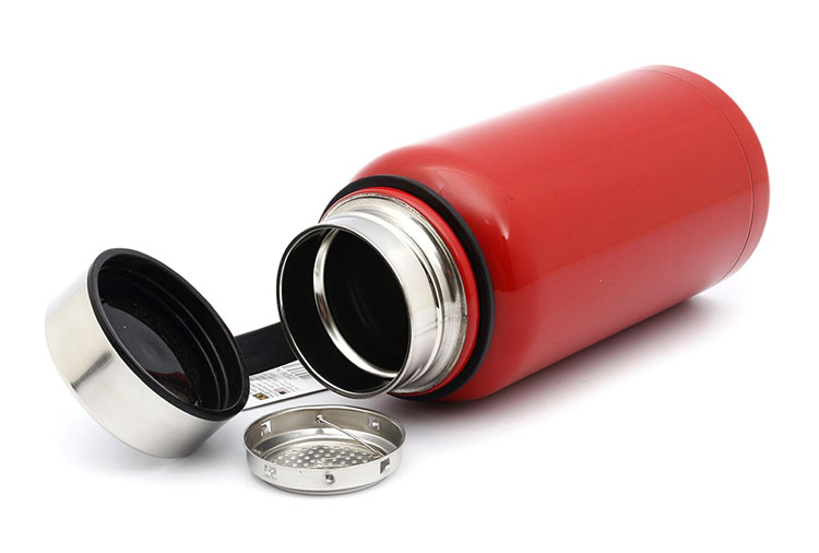 A red colored water bottle with silver cap