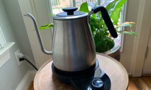Close up of Oxo Gooseneck Kettle on a wooden table