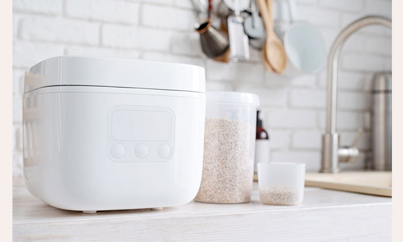 electric-rice-cooker-on-wooden-counter-top-1