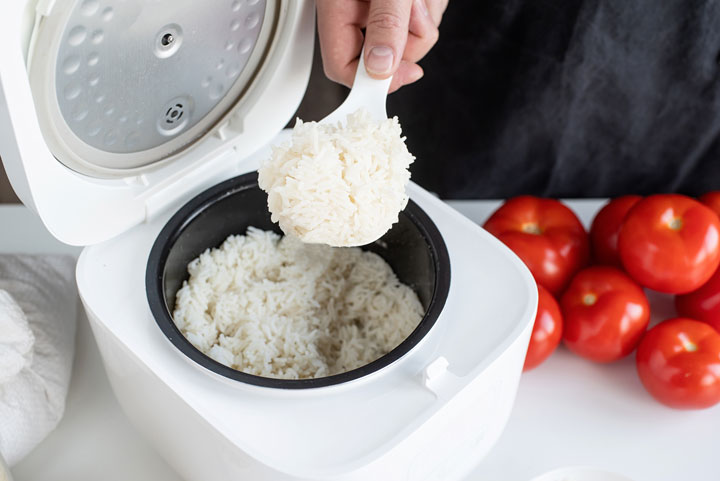 electric-rice-cooker-on-wooden-counter-top-in-th